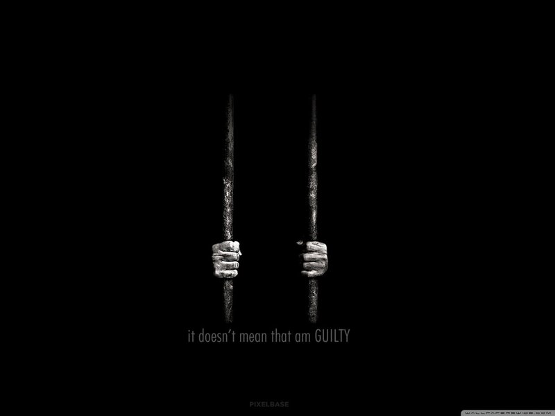 hands gripping prison bars