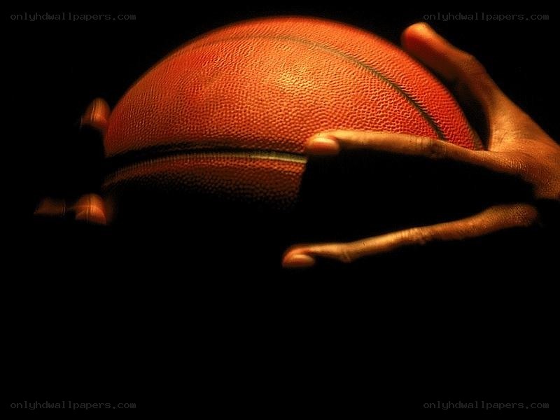 hands holding a basketball
