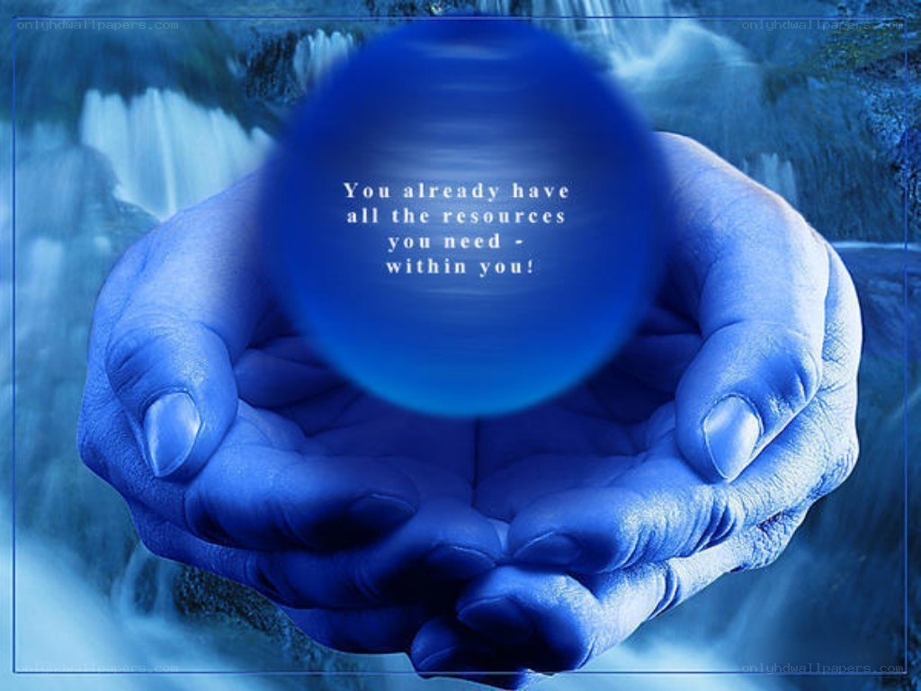 hands holding a blue sphere