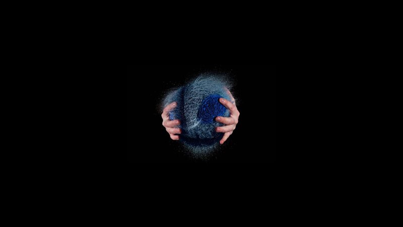 hands holding a blue sphere
