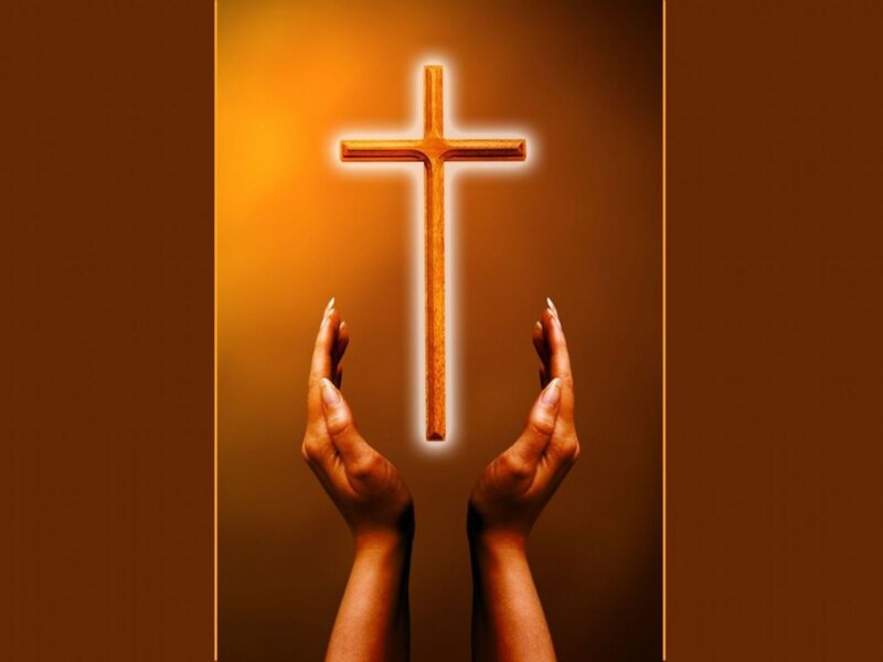 Hands Holding a Cross
