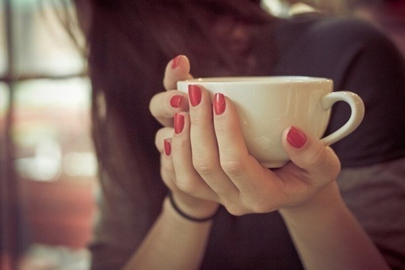 Hands Holding a Cup