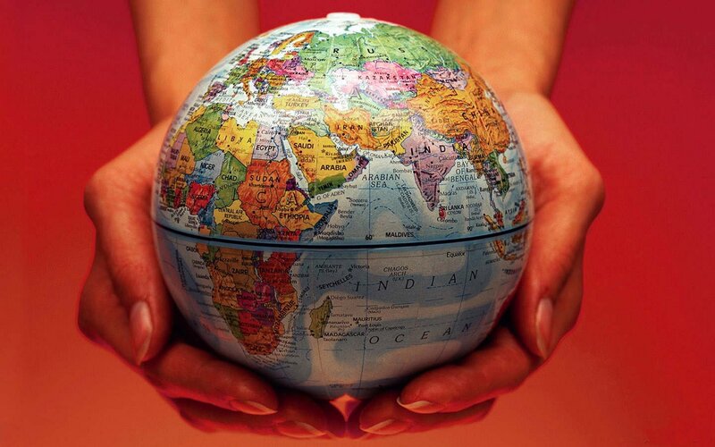 hands holding a globe