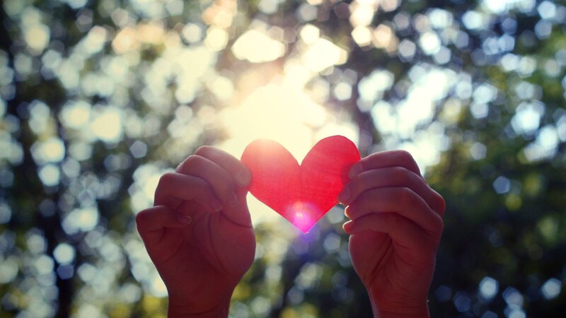 Hands holding a heart shape