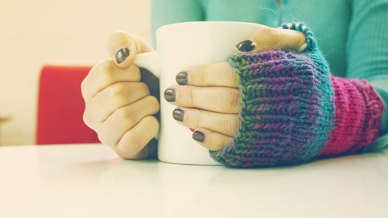 hands holding a mug