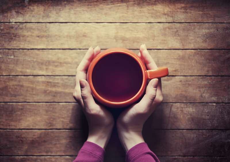 Hands Holding a Mug — Brown