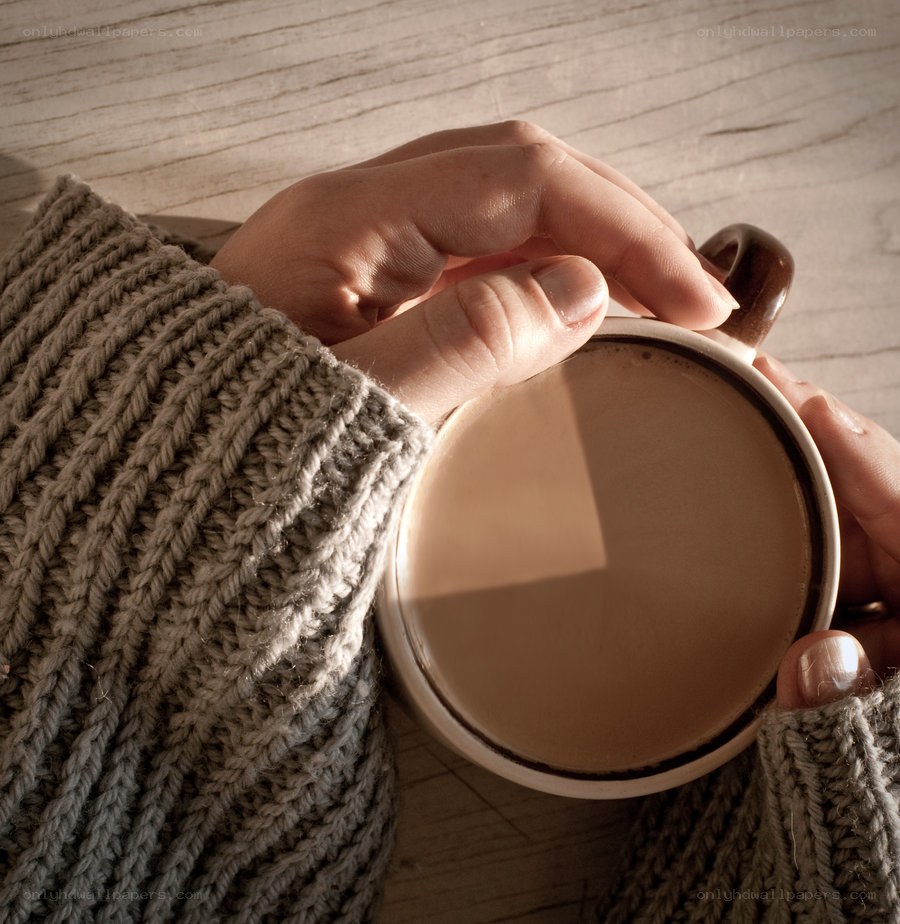 hands holding a warm mug