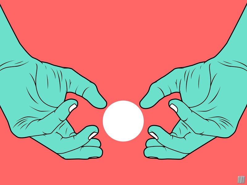 hands holding a white ball