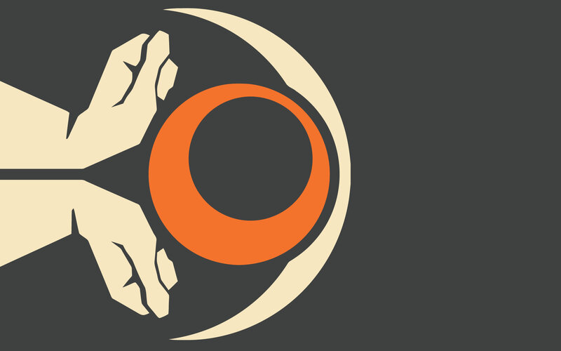 hands holding an orange ring