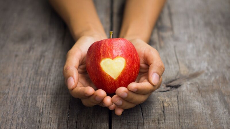 Hands Holding Apple — Red