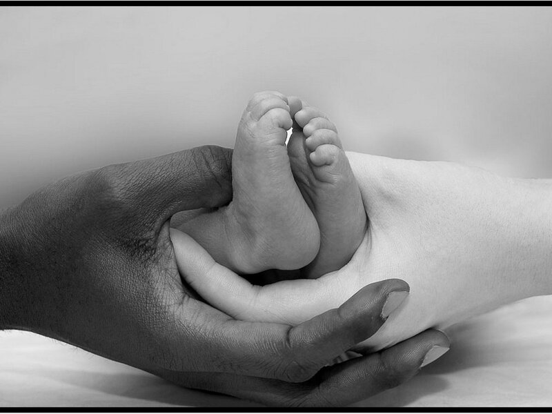 hands holding baby feet