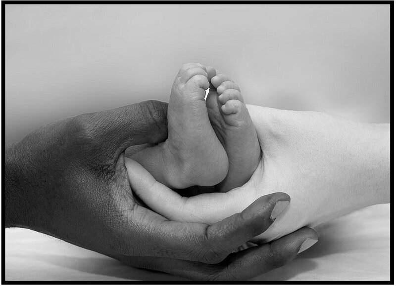 hands holding baby feet