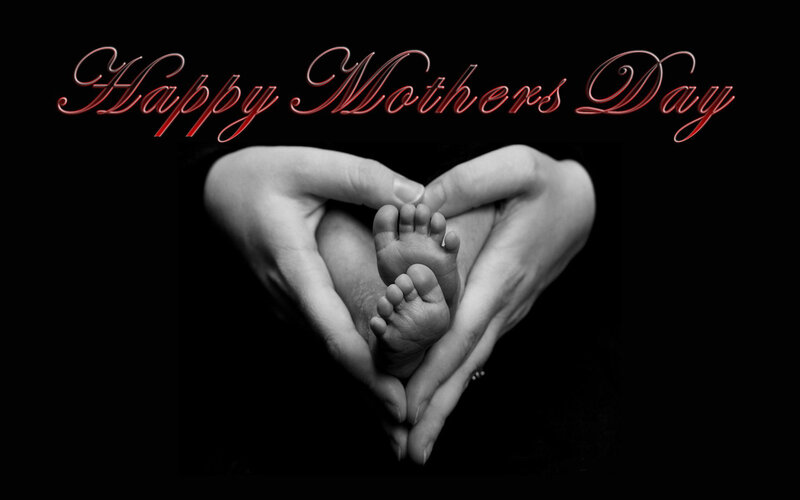 Hands Holding Baby Feet — Black