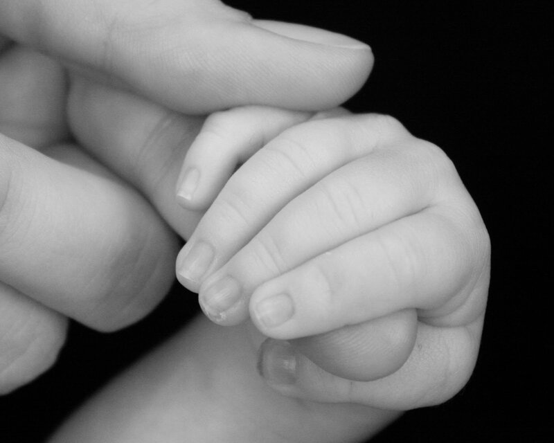 hands holding baby hand