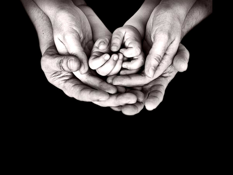 Hands Holding Baby Hand — Black