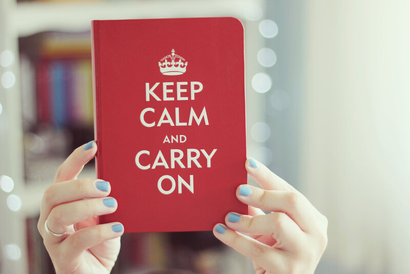 Hands Holding Book — Red