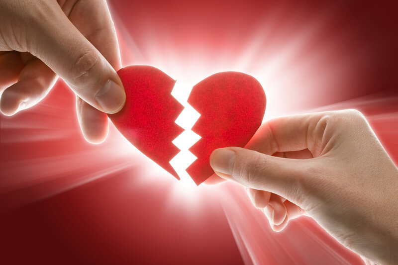 Hands Holding Broken Heart
