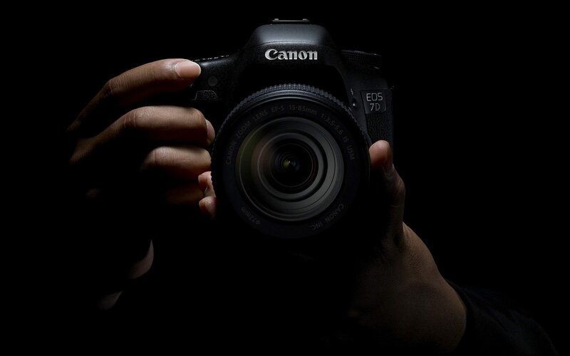 Hands Holding Camera — Black, Dramatic, Photograph
