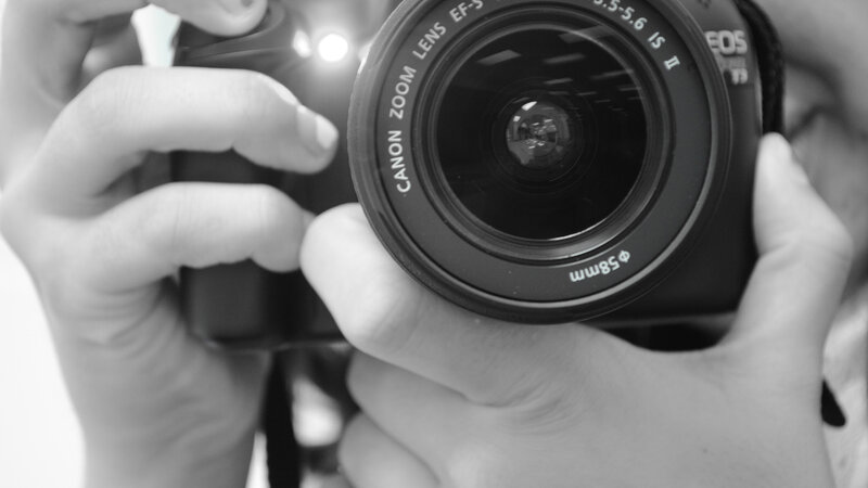 Hands Holding Camera