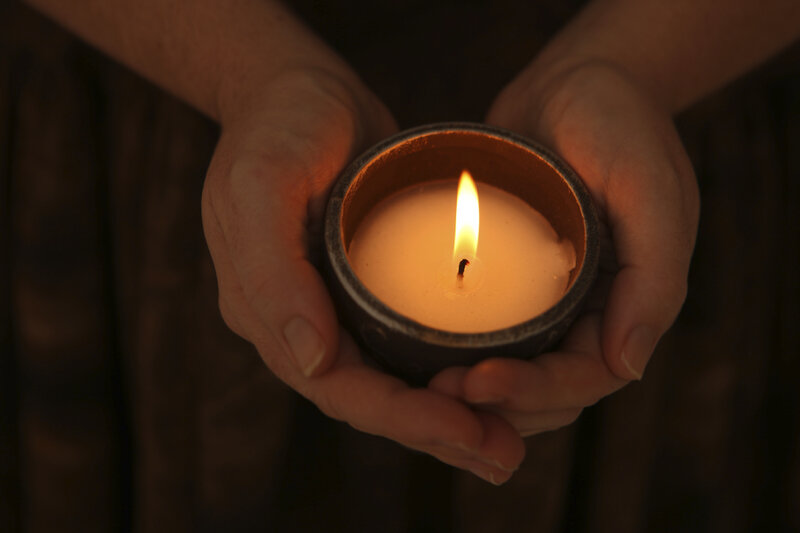 Hands Holding Candle — Brown