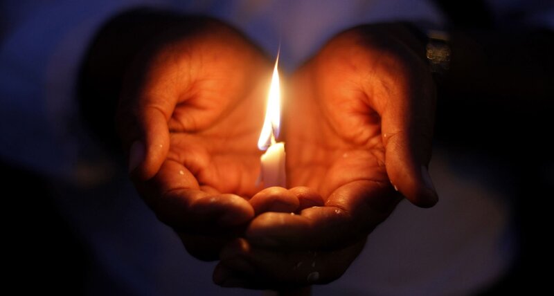 Hands Holding Candle — Orange