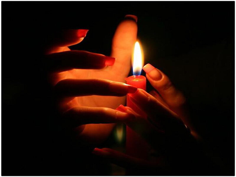 Hands Holding Candle