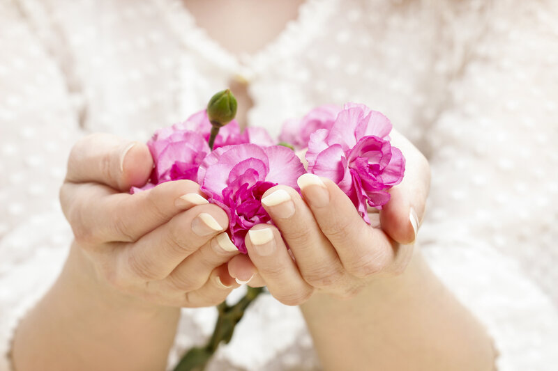 Hands Holding Carnations