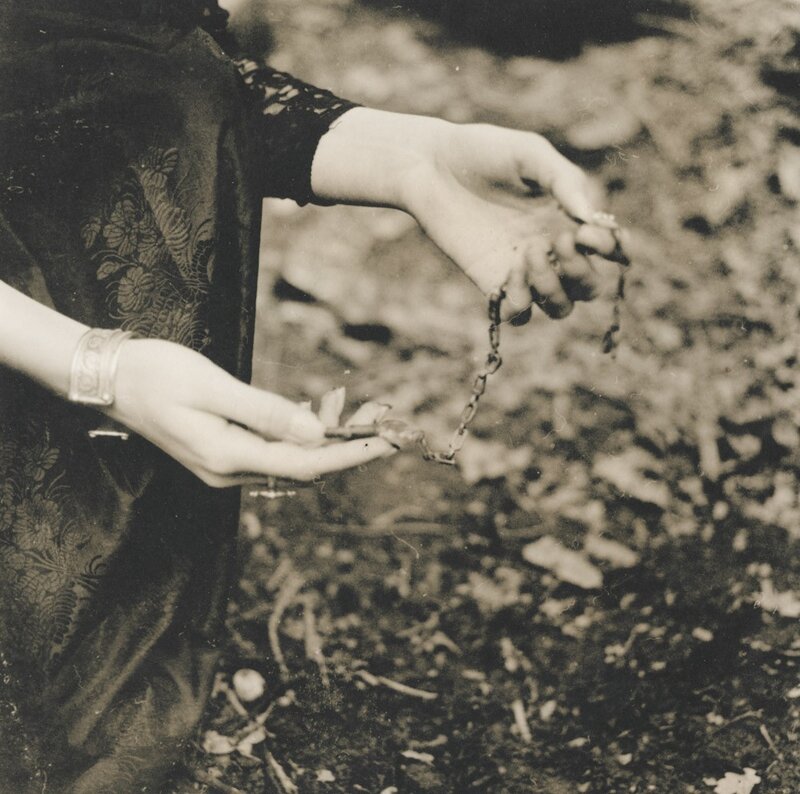 Hands Holding Chain