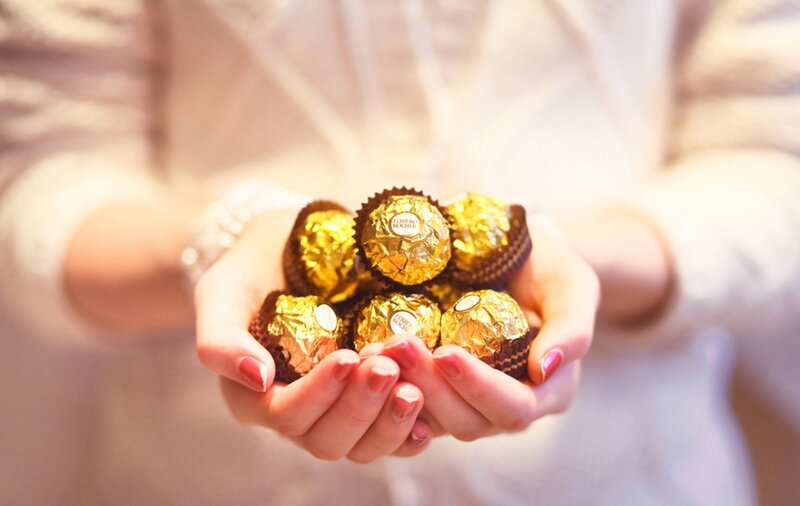 Hands Holding Chocolates