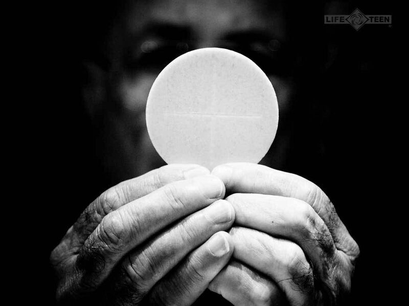Hands Holding Communion Wafer