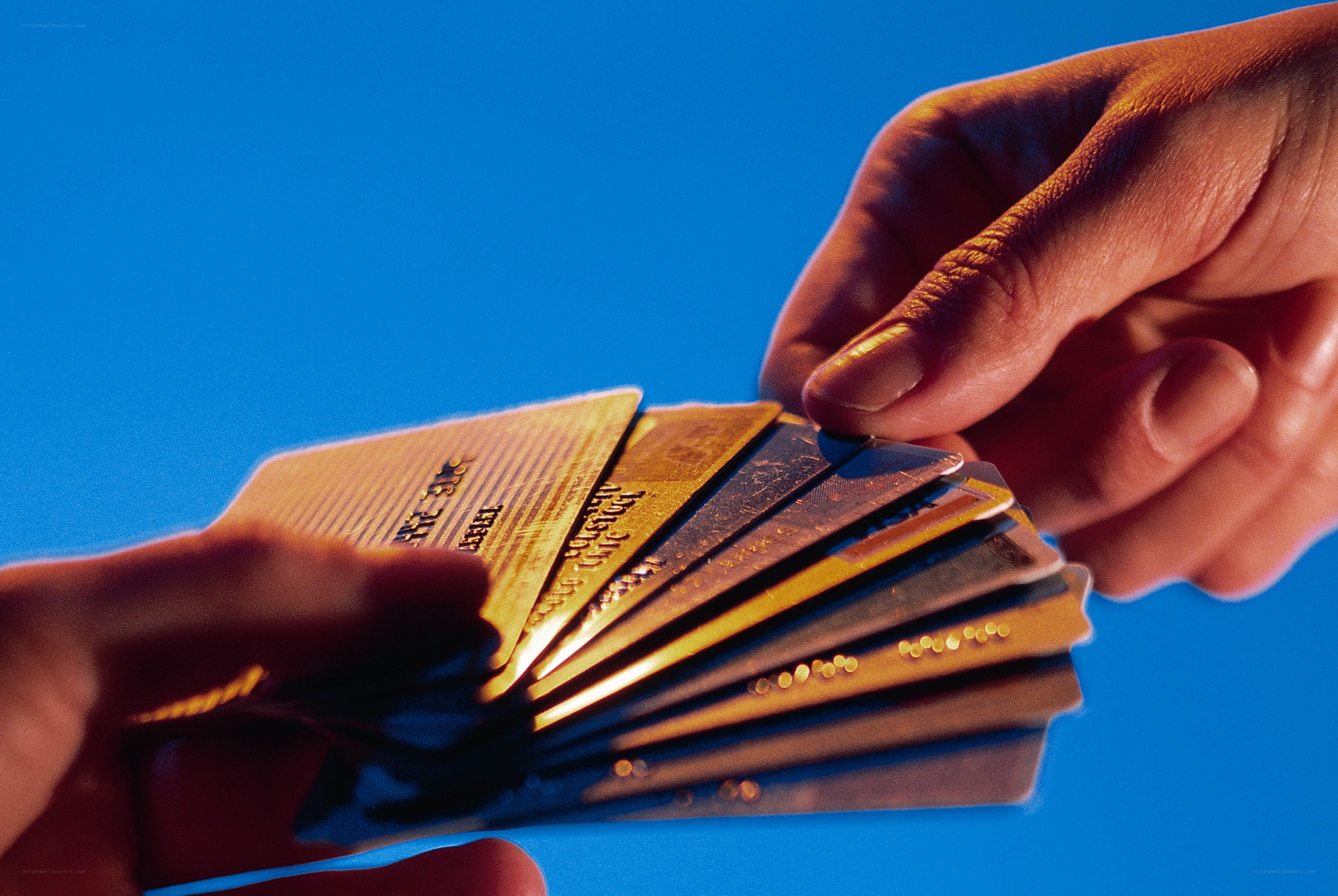 hands holding credit cards