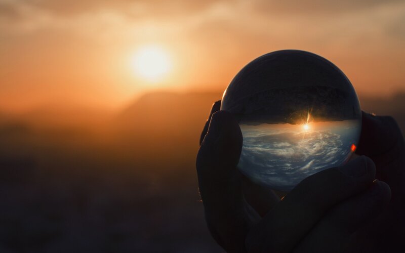 Hands Holding Crystal Ball — Orange