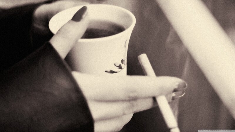 Hands Holding Cup and Cigarette