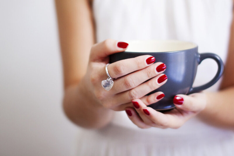 Hands Holding Cup