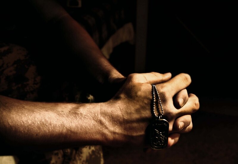 Hands Holding Dog Tag