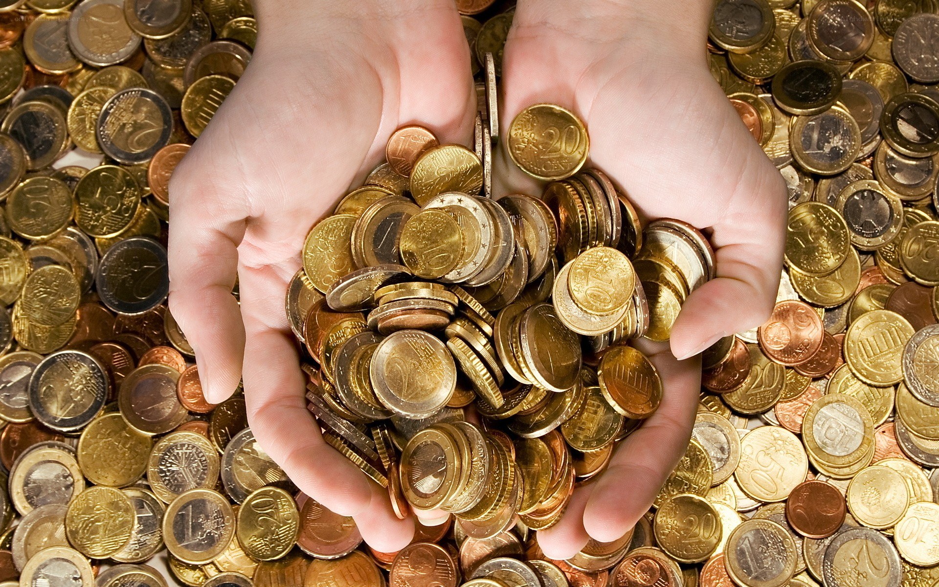 hands holding euro coins