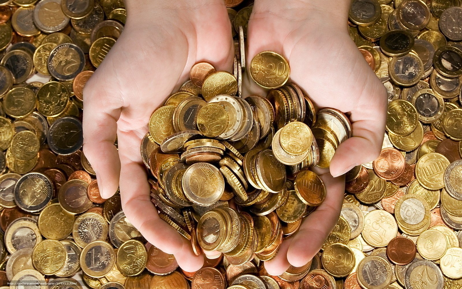 Hands holding euro coins