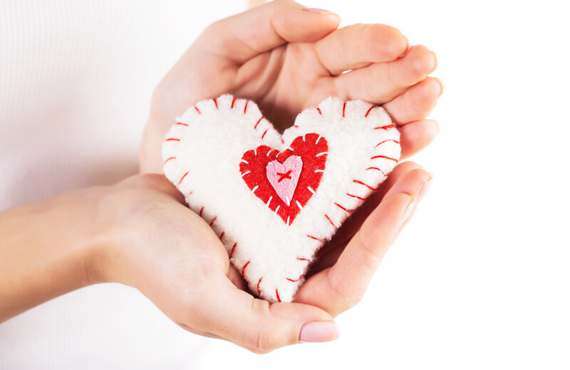 Hands Holding Felt Heart