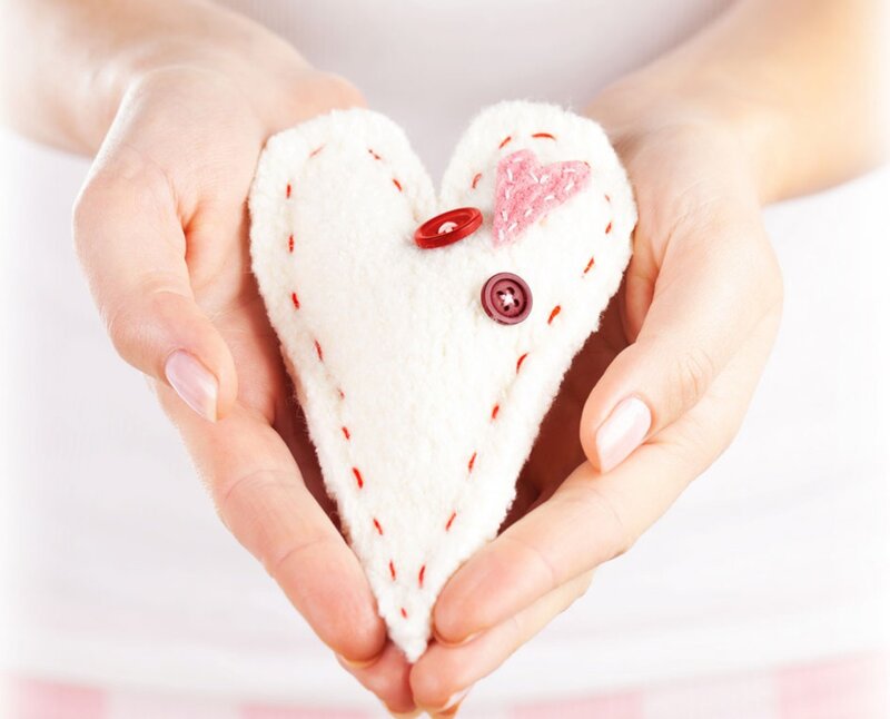 Hands Holding Felt Heart — White