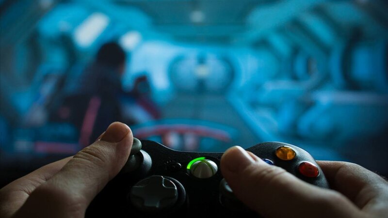 Hands Holding Game Controller — Black