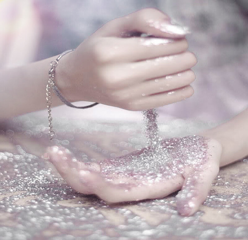 Hands Holding Glitter