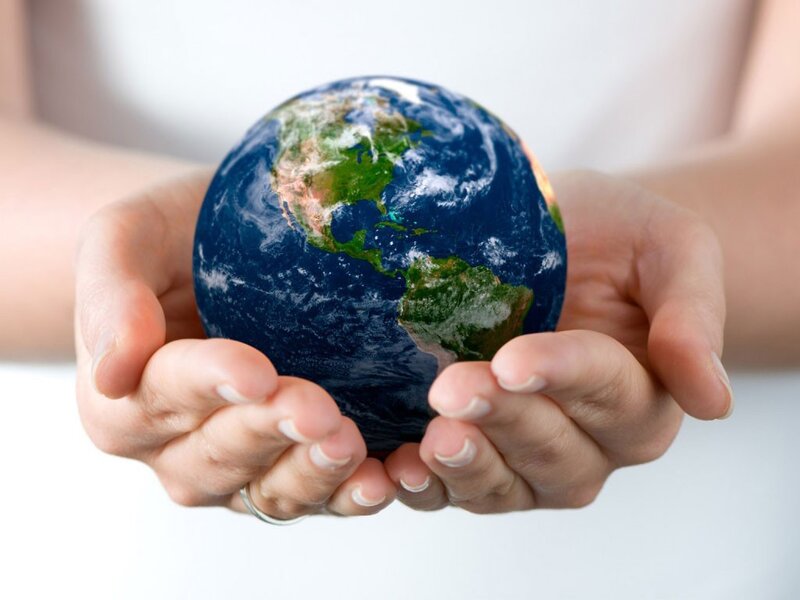 Hands Holding Globe — Calm