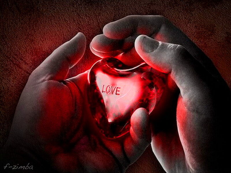 Hands Holding Glowing Heart — Red