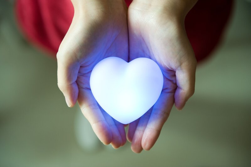 Hands Holding Glowing Heart — White, Calm