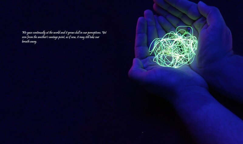 hands holding glowing lines