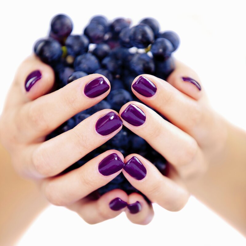 Hands Holding Grapes