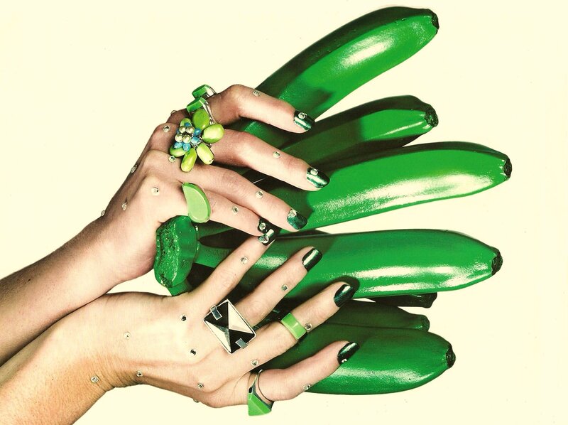 hands holding green bananas
