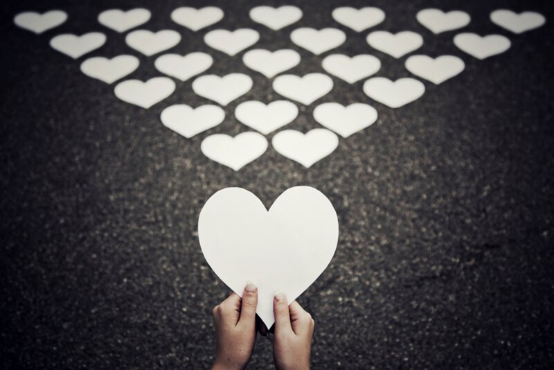 Hands Holding Heart Cutout