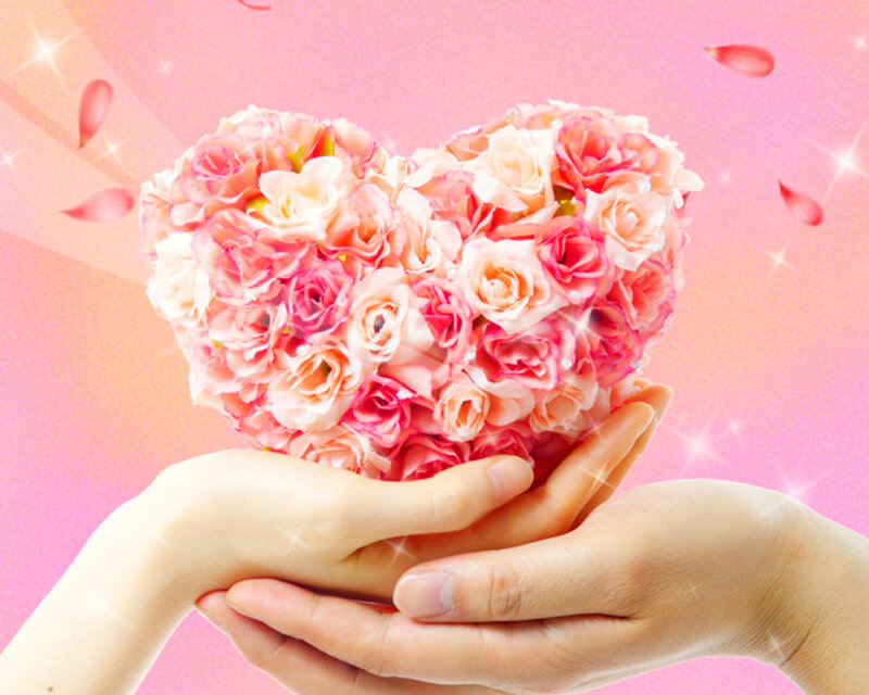 Hands Holding Heart of Roses