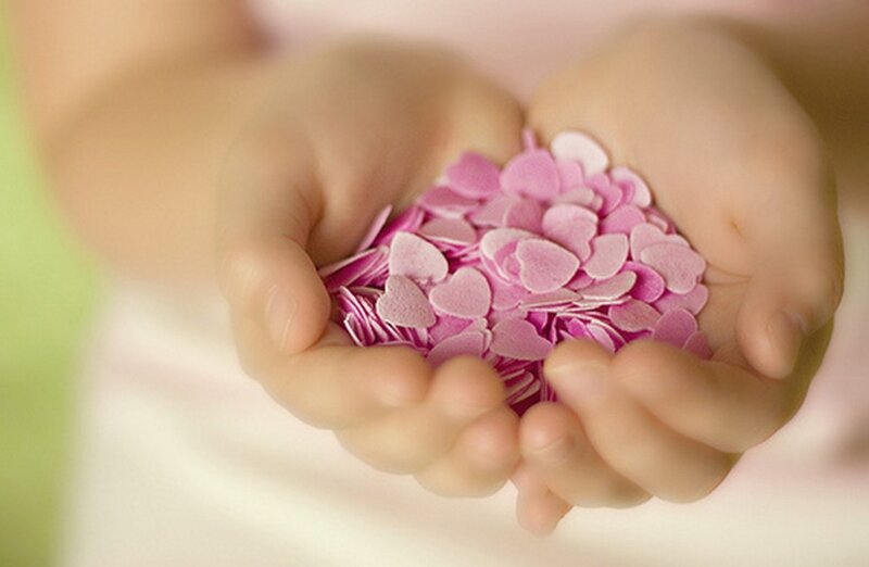 Hands Holding Heart-shaped Confetti